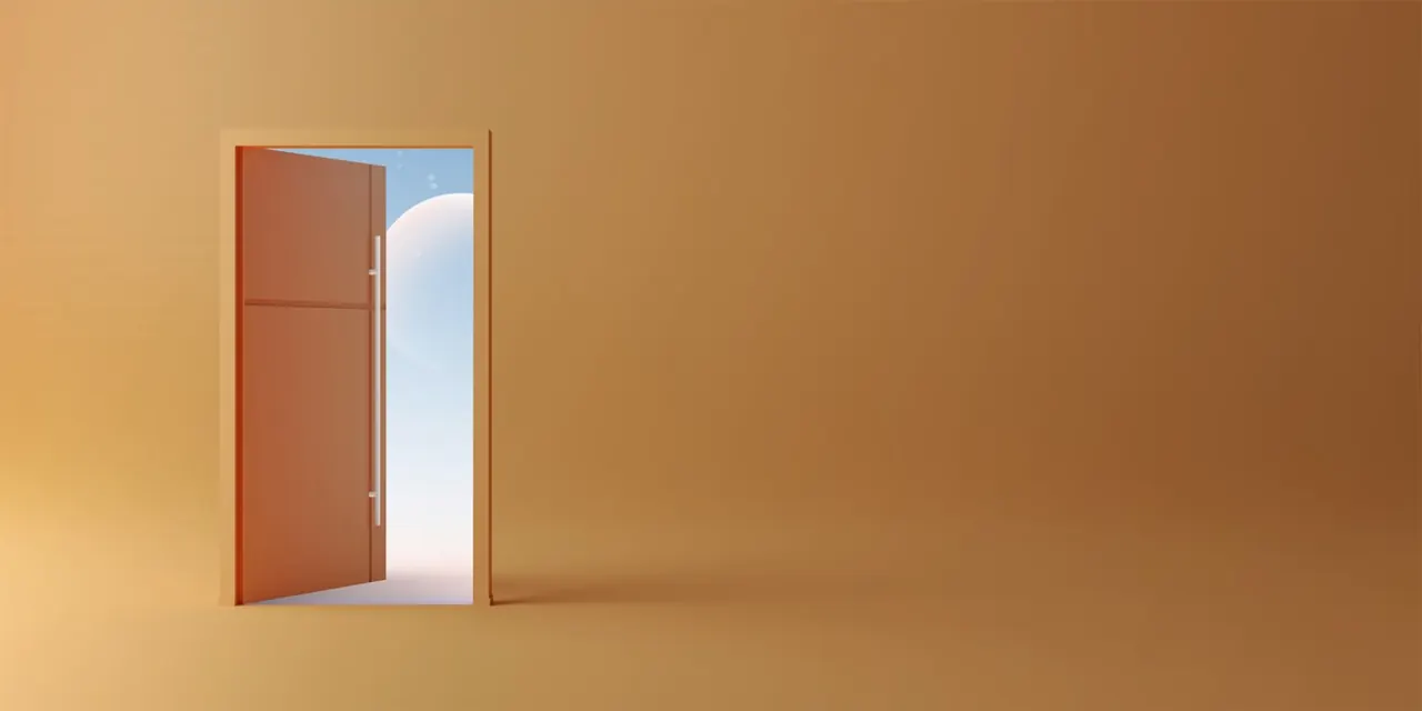 An open door in a warm, empty room